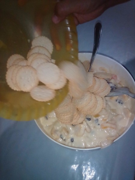 adding crackers to bowl