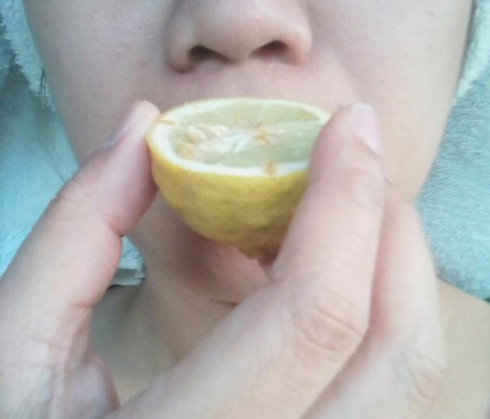 Lemon as Substitute for Smelling Salts - person inhaling lemon