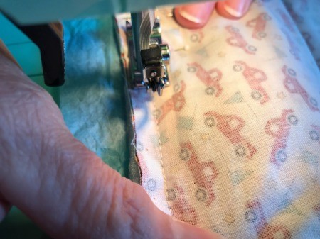 Whole Cloth Tied Quilt with Ric Rac Trim - sewing three layers together