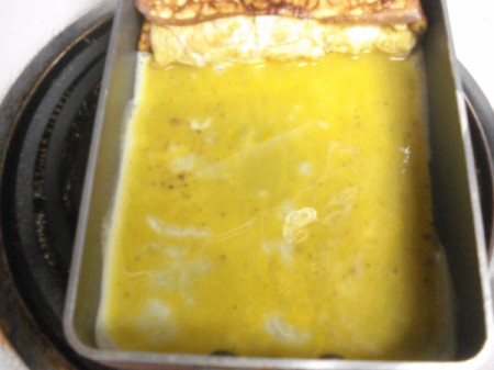 cooking egg and omelet at one end