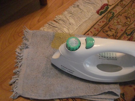 Flattening a Curled Rug - ironing over damp cloth