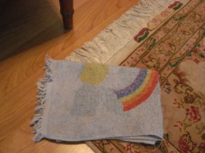 Flattening a Curled Rug - damp cloth on rug corner