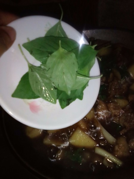 adding basil to skillet