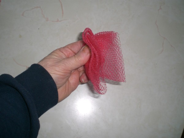 A folded netted vegetable bag.