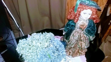 Blue hydrangea and a redheaded Victorian doll