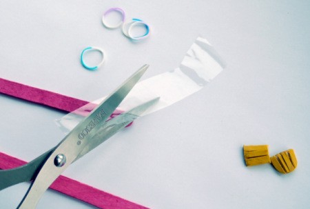 Popsicle Stick Toy Harmonica - cut piece of cellophane packaging to fit length of sticks