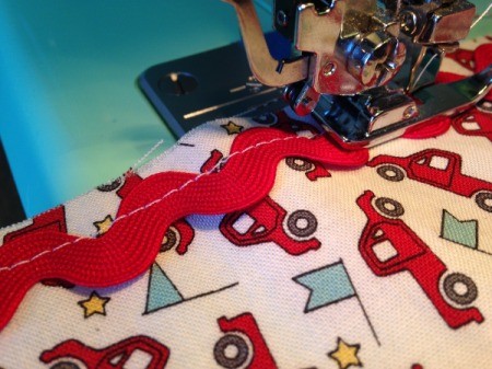 Whole Cloth Tied Quilt with Ric Rac Trim - sewing ric rac in place