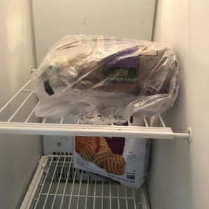 A loaf of bread in the freezer.