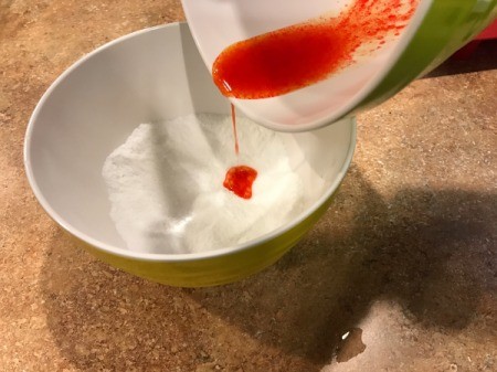 Homemade Bath Bombs - pour liquid ingredients into dry ones