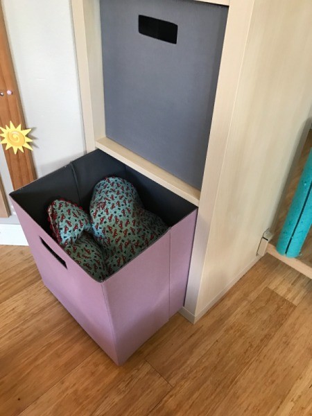 Installing a Baby Gate for a Wide Archway - blanket filled fabric baskets in shelf assembly