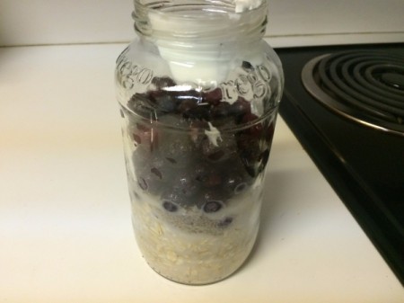 milk, oats and berries in jar
