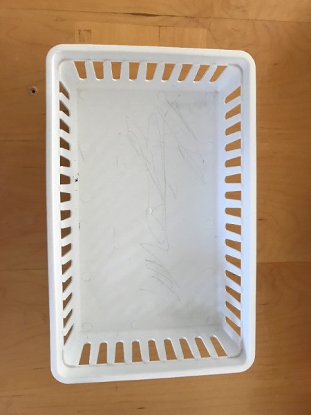 An empty white basket.