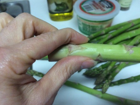 snapping ends off asparagus