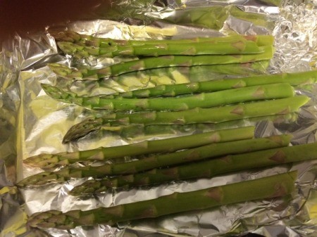 Asparagus laid out on foil