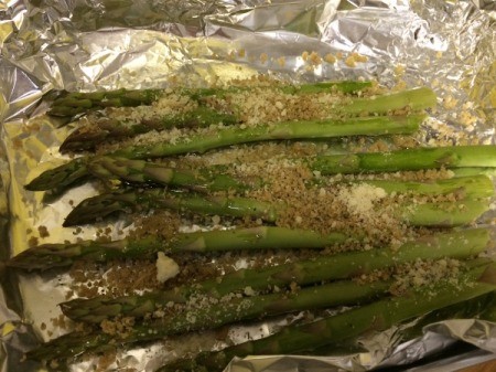 sprinkling parmesan on asparagus