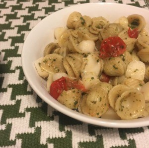 bowl of pasta with tomatoes and mozzarella