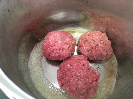 steak patties in pan