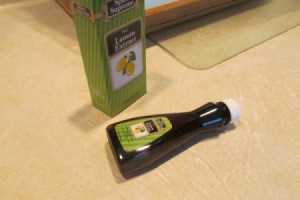 Lemon Extract for a Clean  Smelling Kitchen - bottle of lemon extract lying on its side on countertop