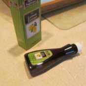 Lemon Extract for a Clean  Smelling Kitchen - bottle of lemon extract lying on its side on countertop