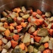 Herb Roasted Brussels Sprouts, Sweet Potatoes and Carrots in bowl