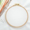 An embroidery hoop set up and ready for a cross stitch project.
