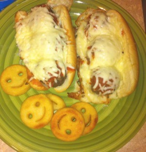 Meatball Subs and happy face fries on plate