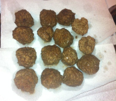 draining cooked meatballs