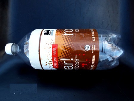 Mini Greenhouse From Soda Bottles - add tape on other bottle