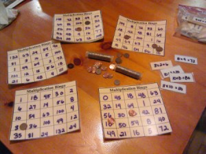 Homemade Math Bingo Game - bingo cards and rolls of pennies