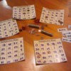 Homemade Math Bingo Game - bingo cards and rolls of pennies