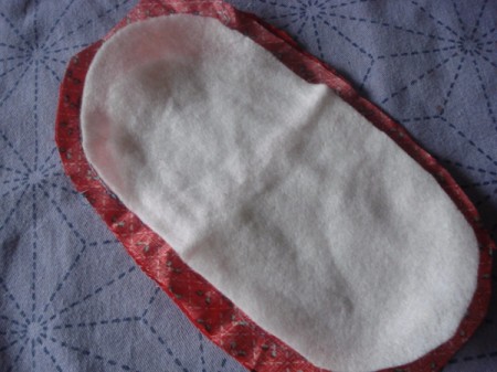 Pot Holders from Shoulder Pads - insert shoulder pad and tack to keep in place