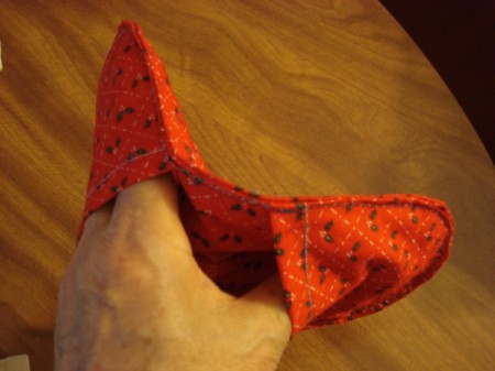 Pot Holders from Shoulder Pads - hand inside pot holder