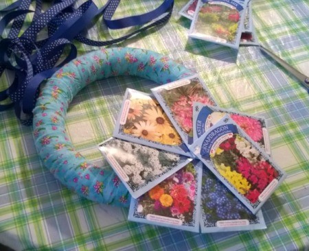 Spring Seed Packet Wreath - fan out seed packets to look like a flower and glue to each other and to the wreath