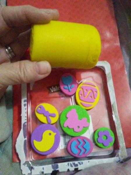 Play-Doh Stamping Activity for Children - open package of stamps and cylinder of Play Doh