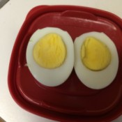 hard boiled egg cut into halves on plate