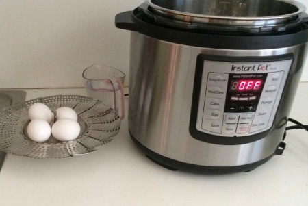 A pressure cooker being used to make hard boiled eggs.