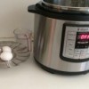 A pressure cooker being used to make hard boiled eggs.