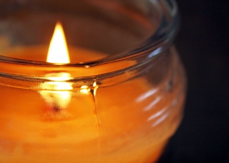 A lit jar candle.