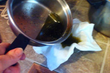 straining oil through cloth