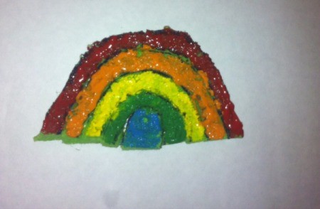 St. Patrick's Day Sponge Paintings - use paint brushes to add paint to each section of the rainbow