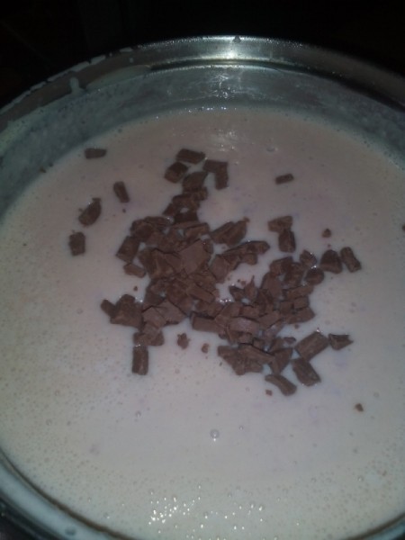 adding chocolate bits to milks