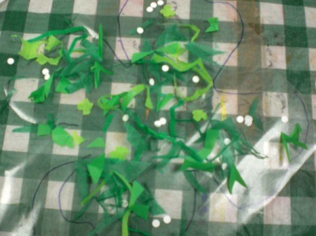 Shamrock Suncatcher - cut out a second square of contact paper peel and stick to decorated one. Smooth out bubbles. Cut shamrock shape now.