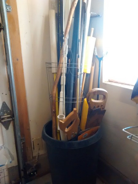 Upright Storage for Long-handled Tools - tools in flower pot