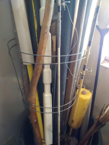 Upright Storage for Long-handled Tools - now stored inside a tomato cage in pot