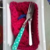 Crocheted Square for Silverware Drying - spoon and fork on red crochet square