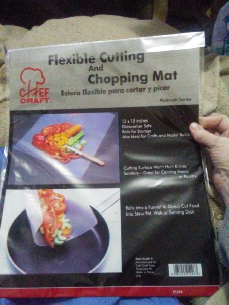 Flexible cutting and chopping mat in a package.