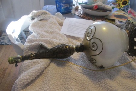 Rewiring a Living Room Lamp - lamp lying on towel to protect globe while dismantling