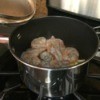shrimp, onions, and garlic in pan