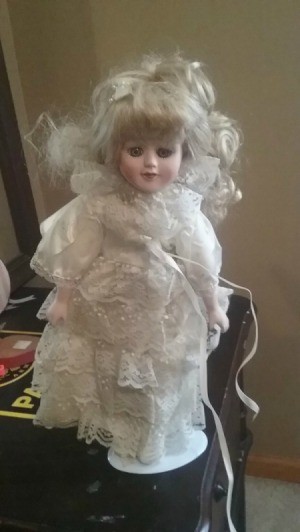 Value of Porcelain Doll - doll wearing a white lace dress
