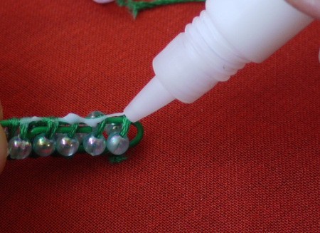 Paperclip and Bead Wrapped Earrings - closeup of applying glue